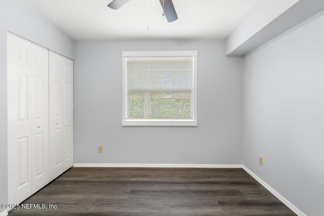 6202 Columbine Dr, Jacksonville, FL 32211 - unfurnished bedroom with a closet, wood finished floors, and a ceiling fan