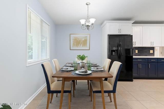 6202 Columbine Dr, Jacksonville, FL 32211 - dining room featuring light tile patterned floors and a chandelier