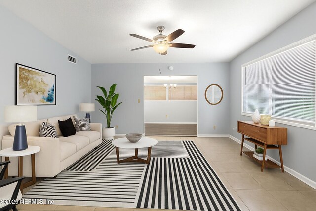 6202 Columbine Dr, Jacksonville, FL 32211 - living room featuring ceiling fan and light tile patterned flooring