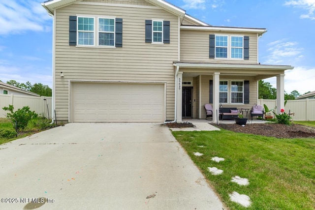 65490 Crested Heron Ct, Yulee, FL 32097 - traditional-style house with a porch, an attached garage, and concrete driveway