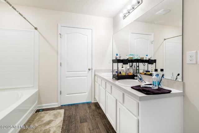 65490 Crested Heron Ct, Yulee, FL 32097 - full bathroom featuring wood finished floors, double vanity, and shower / bathtub combination
