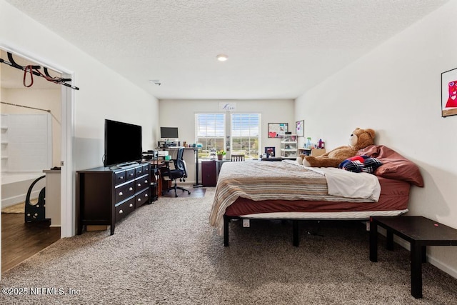 65490 Crested Heron Ct, Yulee, FL 32097 - bedroom with carpet flooring, an office area, and a textured ceiling