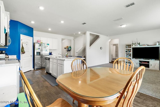65490 Crested Heron Ct, Yulee, FL 32097 - dining room with stairs, dark wood finished floors, and recessed lighting