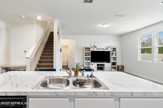 65490 Crested Heron Ct, Yulee, FL 32097 - kitchen featuring open floor plan and light stone countertops