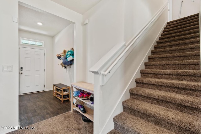 65490 Crested Heron Ct, Yulee, FL 32097 - entrance foyer featuring stairway and dark wood finished floors