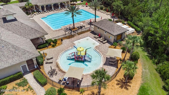 65490 Crested Heron Ct, Yulee, FL 32097 - community pool featuring a water play area and a patio