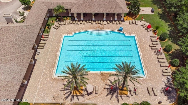 65490 Crested Heron Ct, Yulee, FL 32097 - community pool featuring a patio area