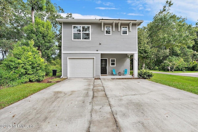 850 Bruen St, Saint Augustine, FL 32084 - view of front facade featuring concrete driveway, a garage, a front yard, and covered porch