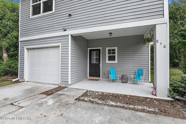 850 Bruen St, Saint Augustine, FL 32084 - doorway to property featuring an attached garage and driveway