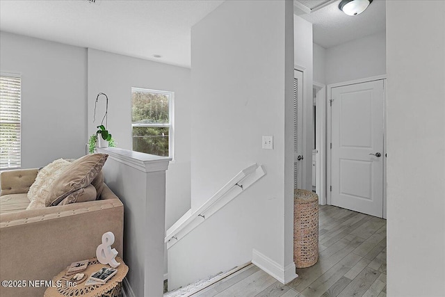 850 Bruen St, Saint Augustine, FL 32084 - hallway with an upstairs landing and wood finished floors