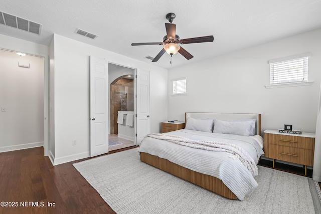 91 Paradise Valley Dr, Ponte Vedra, FL 32081 - bedroom featuring multiple windows, arched walkways, wood finished floors, and a ceiling fan