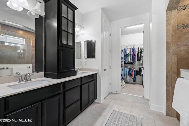 91 Paradise Valley Dr, Ponte Vedra, FL 32081 - full bathroom featuring double vanity, a tile shower, and a spacious closet
