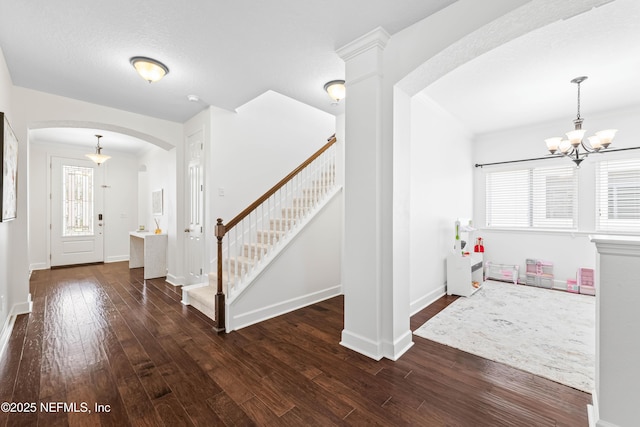91 Paradise Valley Dr, Ponte Vedra, FL 32081 - entryway with arched walkways, stairway, hardwood / wood-style floors, a chandelier, and healthy amount of natural light