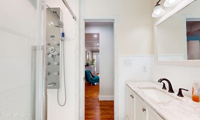 90 SE Forest St, Keystone Heights, FL 32656 - bathroom featuring a tile shower, vanity, and wood finished floors