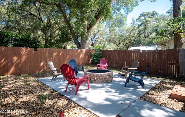 90 SE Forest St, Keystone Heights, FL 32656 - fenced backyard featuring an outdoor fire pit and a patio area