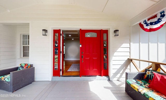 90 SE Forest St, Keystone Heights, FL 32656 - view of exterior entry with a porch and board and batten siding