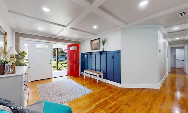 90 SE Forest St, Keystone Heights, FL 32656 - entrance foyer featuring light wood finished floors, coffered ceiling, beamed ceiling, a wainscoted wall, and recessed lighting