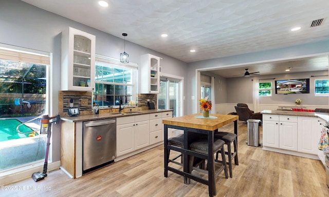90 SE Forest St, Keystone Heights, FL 32656 - kitchen featuring dishwasher, light wood-type flooring, white cabinetry, and recessed lighting