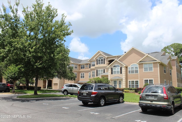 13810 Sutton Park Dr N Unit 528, Jacksonville, FL 32224 - view of building exterior featuring uncovered parking