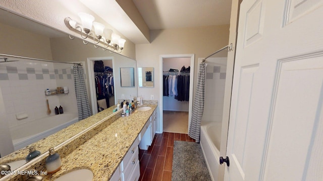 13810 Sutton Park Dr N Unit 528, Jacksonville, FL 32224 - full bathroom with shower / bath combination with curtain, double vanity, wood finish floors, and a walk in closet