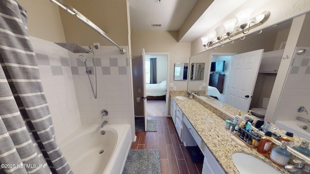 13810 Sutton Park Dr N Unit 528, Jacksonville, FL 32224 - ensuite bathroom with shower / bathtub combination with curtain, double vanity, and wood finish floors