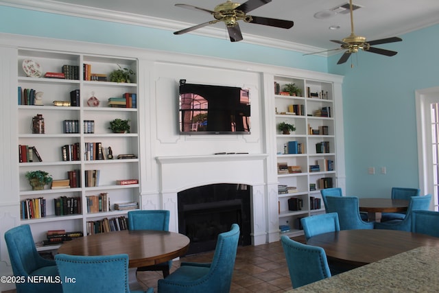 13810 Sutton Park Dr N Unit 528, Jacksonville, FL 32224 - living area featuring crown molding, ceiling fan, and a fireplace