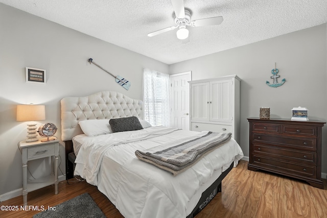 3172 Twilight Ct, Middleburg, FL 32068 - bedroom with a textured ceiling, wood finished floors, and ceiling fan