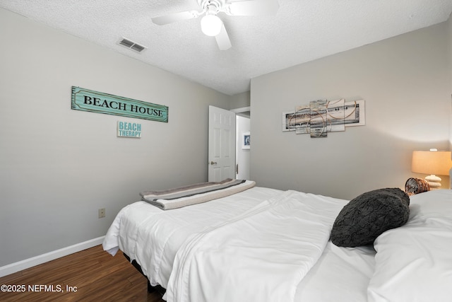 3172 Twilight Ct, Middleburg, FL 32068 - bedroom featuring wood finished floors, a ceiling fan, and a textured ceiling