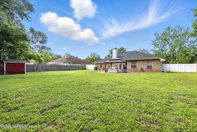 3172 Twilight Ct, Middleburg, FL 32068 - fenced backyard with a patio, a storage shed, and a gazebo
