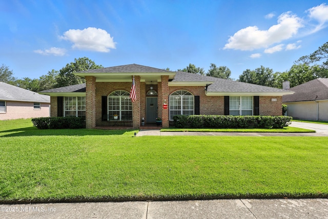 3172 Twilight Ct, Middleburg, FL 32068 - view of front of property featuring a front lawn, brick siding, and a shingled roof