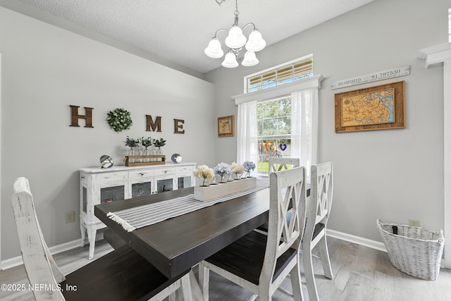 3172 Twilight Ct, Middleburg, FL 32068 - dining space with a chandelier and wood finished floors