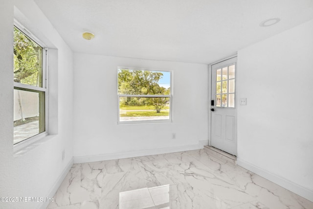 1901 Forest Hills Rd, Jacksonville, FL 32208 - unfurnished room with marble look tile flooring, healthy amount of natural light, and a smoke detector