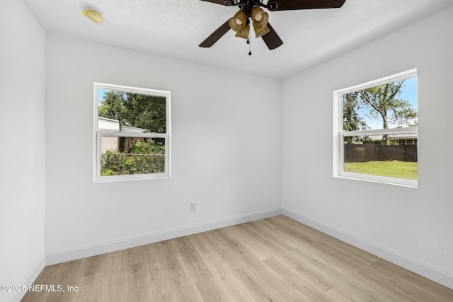 1901 Forest Hills Rd, Jacksonville, FL 32208 - spare room featuring plenty of natural light, light wood-style flooring, and ceiling fan