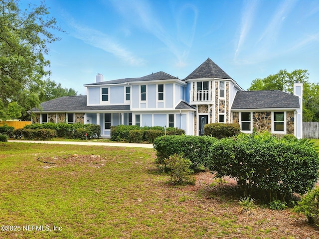 6615 Camelot Ct, Keystone Heights, FL 32656 - view of front of home with a chimney, stone siding, and a balcony