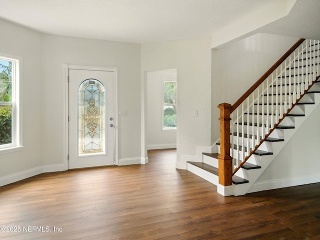 6615 Camelot Ct, Keystone Heights, FL 32656 - foyer entrance with plenty of natural light, stairway, and wood finished floors