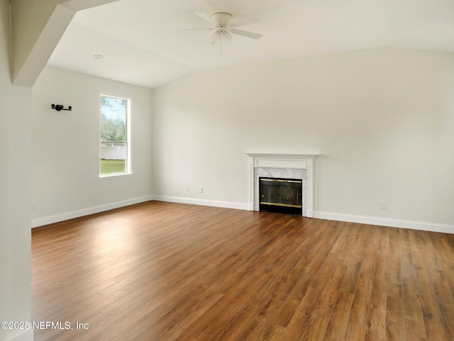 6615 Camelot Ct, Keystone Heights, FL 32656 - unfurnished living room featuring lofted ceiling, ceiling fan, a fireplace, and dark wood finished floors