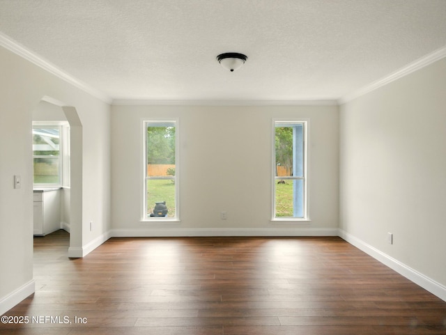 6615 Camelot Ct, Keystone Heights, FL 32656 - empty room featuring ornamental molding, dark wood-type flooring, arched walkways, and a textured ceiling
