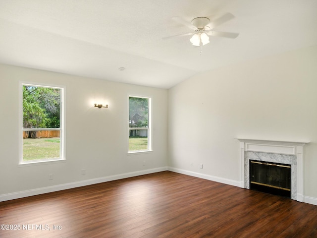 6615 Camelot Ct, Keystone Heights, FL 32656 - unfurnished living room with dark wood-type flooring, healthy amount of natural light, ceiling fan, and a fireplace