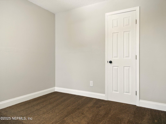 6615 Camelot Ct, Keystone Heights, FL 32656 - empty room featuring dark colored carpet and a textured ceiling