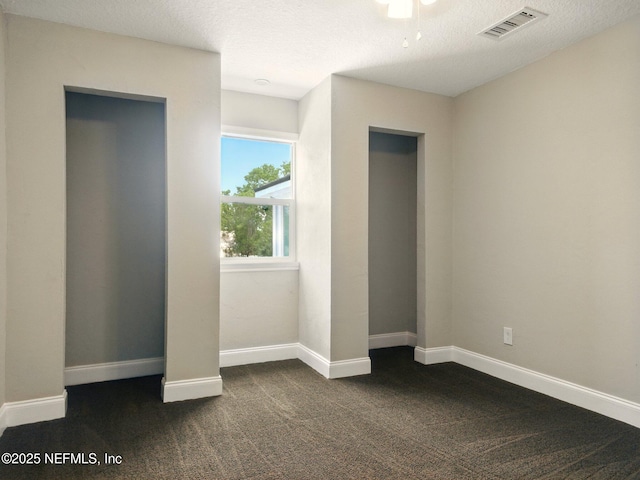 6615 Camelot Ct, Keystone Heights, FL 32656 - unfurnished bedroom featuring dark carpet and baseboards