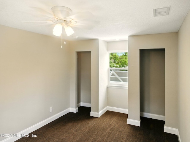 6615 Camelot Ct, Keystone Heights, FL 32656 - unfurnished bedroom with ceiling fan and dark carpet
