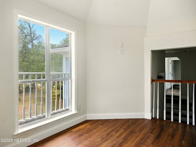 6615 Camelot Ct, Keystone Heights, FL 32656 - empty room featuring dark wood-style flooring and lofted ceiling
