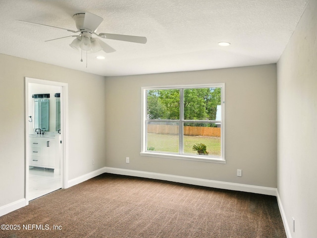 6615 Camelot Ct, Keystone Heights, FL 32656 - spare room with dark carpet, a ceiling fan, a textured ceiling, and recessed lighting