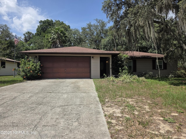 1406 Keats St, Inverness, FL 32250 - view of front of house featuring concrete driveway and an attached garage