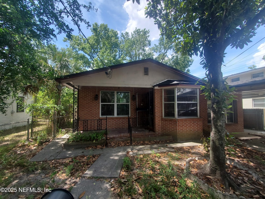 1656 W 31st St, Jacksonville, FL 32209 - bungalow-style house featuring brick siding and a porch