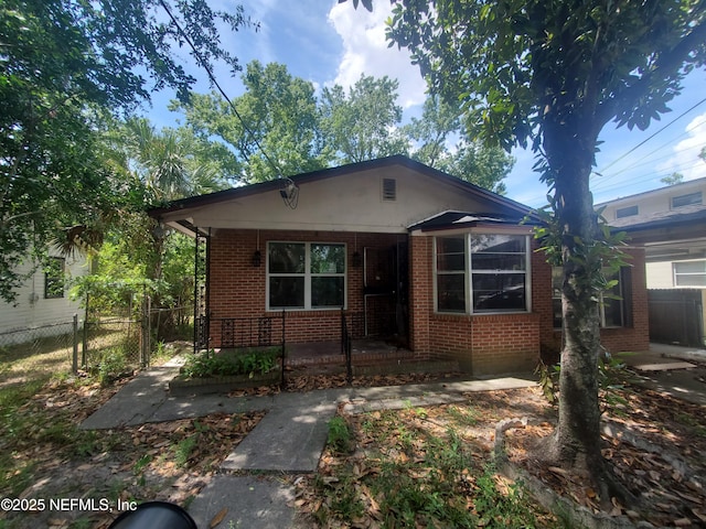 1656 W 31st St, Jacksonville, FL 32209 - bungalow-style house featuring brick siding and a porch
