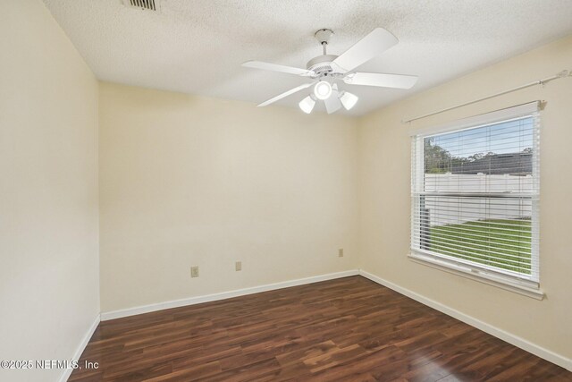 12551 Hunters Branch Way, Jacksonville, FL 32224 - spare room featuring dark wood finished floors, a textured ceiling, and a ceiling fan