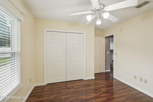 12551 Hunters Branch Way, Jacksonville, FL 32224 - unfurnished bedroom with dark wood finished floors, a closet, and a ceiling fan