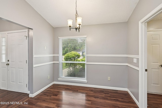 12551 Hunters Branch Way, Jacksonville, FL 32224 - unfurnished dining area with a chandelier, wood finished floors, and vaulted ceiling