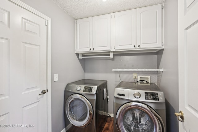 12551 Hunters Branch Way, Jacksonville, FL 32224 - laundry room with separate washer and dryer, cabinet space, and a textured ceiling